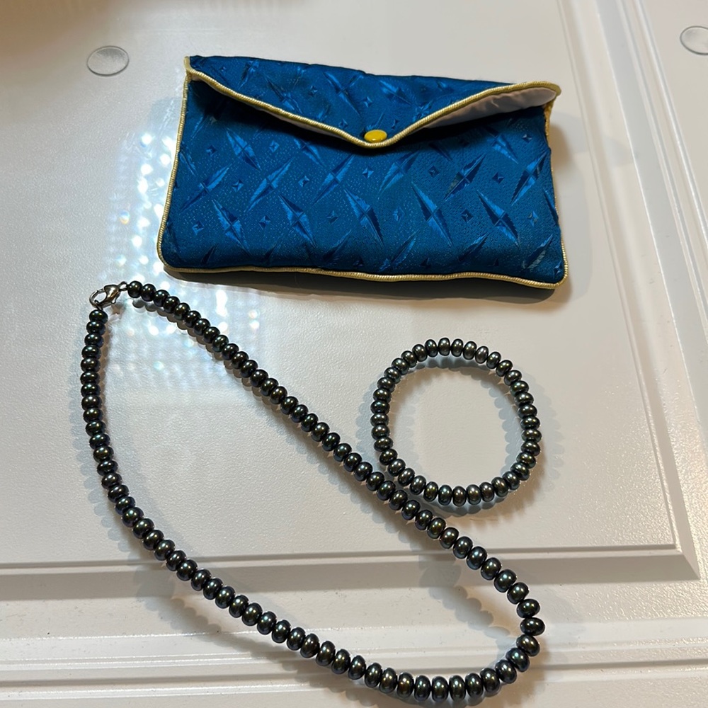 Pearl necklace and bracelet set with dust bag - color is a greenish charcoal